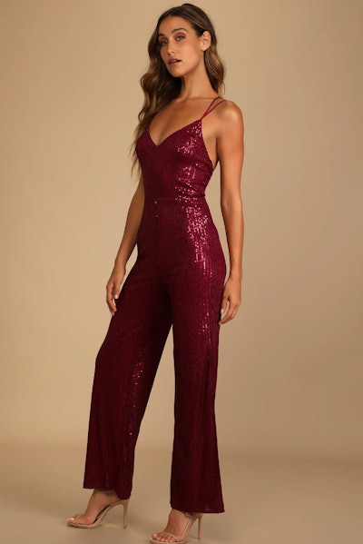 Isn't it Iconic Wine Red Sequin Strappy Jumpsuit is a sexy Valentine's Day outfit idea.