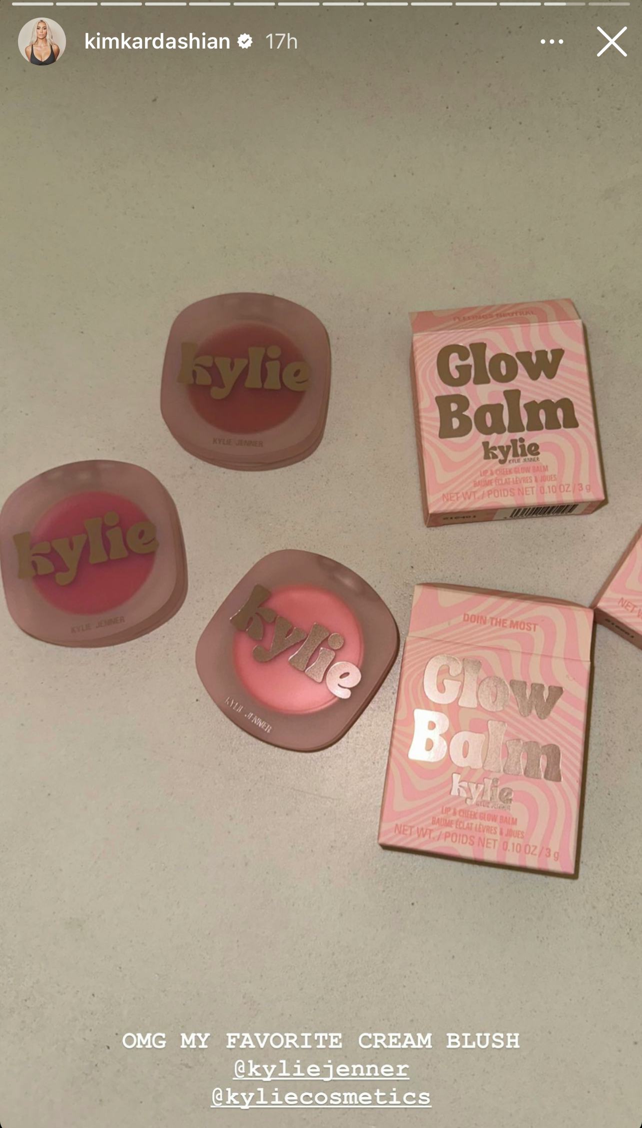 Kim Kardashian promotes Kylie Cosmetics products in bed.