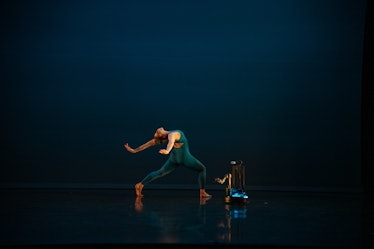 An image of a dancer performing with a robot in 