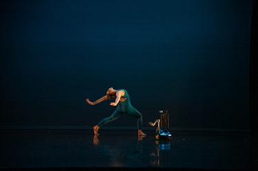 An image of a dancer performing with a robot in 