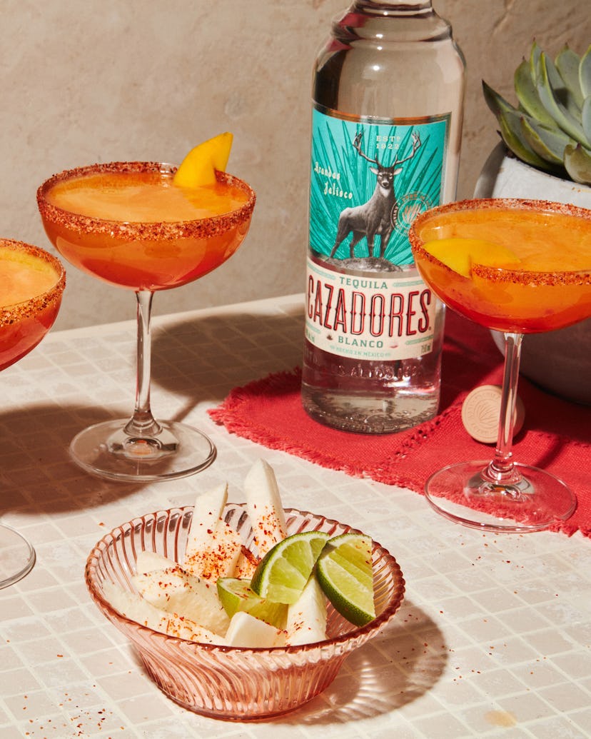 This fruity cocktail includes tequila, mango, and lime