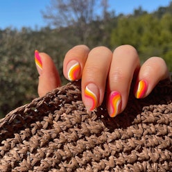 Swirly nails, a spring 2023 nail art trend.