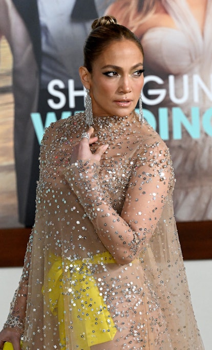 Jennifer Lopez at the Shotgun Wedding premiere where she wore two couture looks on the red carpet