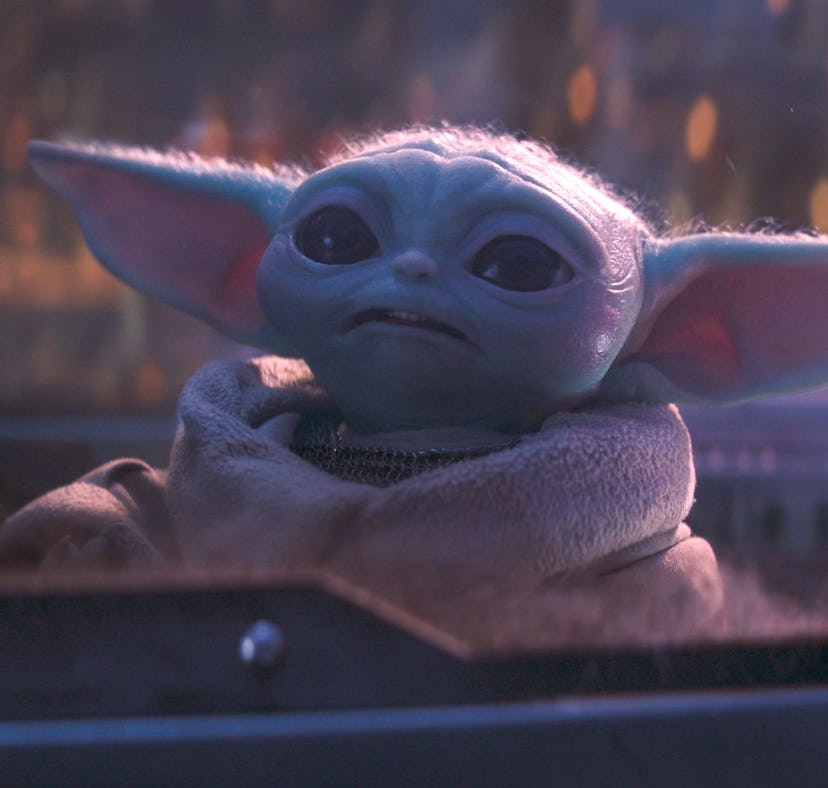 Din Djarin (Pedro Pascal) and Grogu in Lucasfilm's THE MANDALORIAN, Season 3