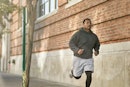 A man jogging in a city.