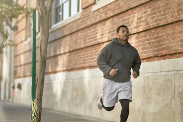 A man jogging down a street