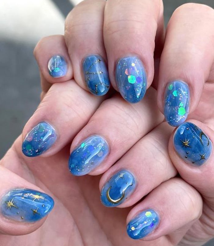 Blue jelly nails with Aquarius nail designs