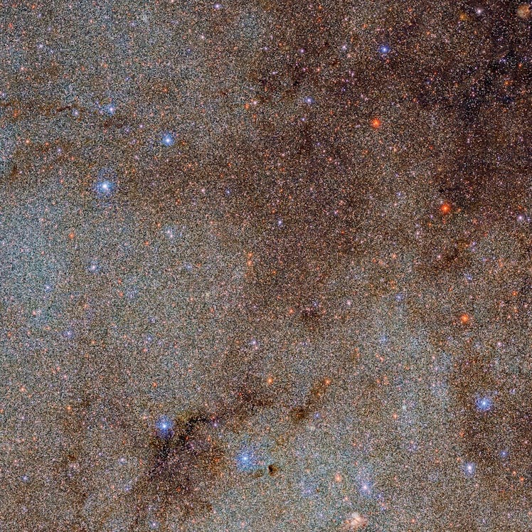 color photo of a starfield with dust clouds