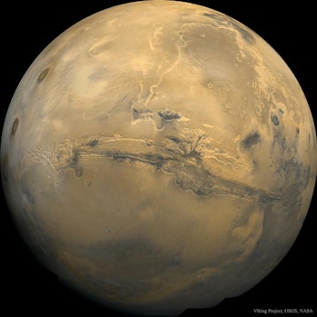 image of Mars, showing a massive crack 1/4 of the way around the planet.