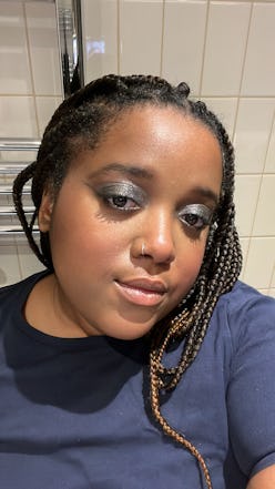 Beauty Writer Vanese Maddix wearing Rare Beauty's powder highlighter. 