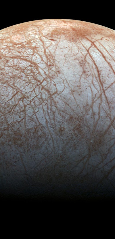 Jupiter's Moon Europa, image of the surface which is criss-crossed by dark red lines and the backgro...