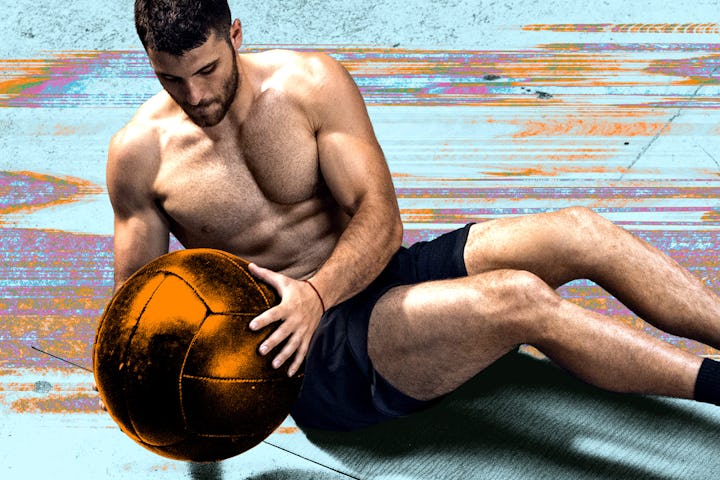 A man doing Russian twist ab exercises with a medicine ball.