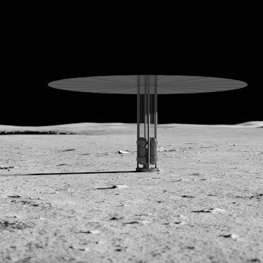 color photo of a cylindrical metal structure with a flat disk on top sitting on the lunar surface