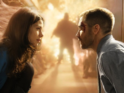 Michelle Monaghan and Jake Gyllenhaal look at each other during an explosion in Source Code