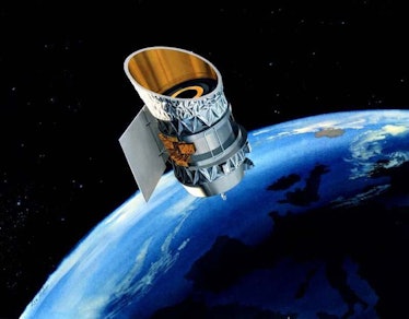 image of a small telescope in space just above earth