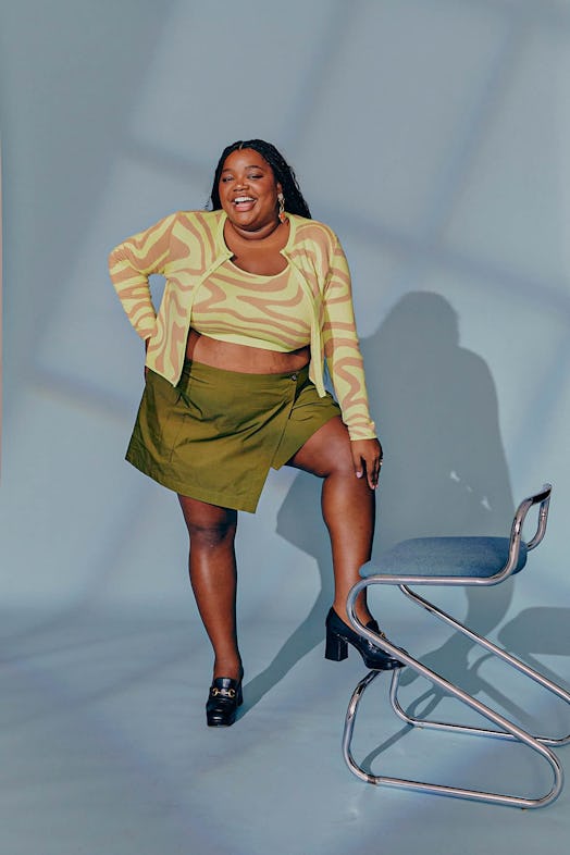 Gabriella Karefa-Johnson in a crop top and cardigan and skirt