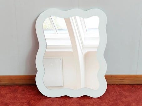 This wavy white mirror is vanilla girl aesthetic home decor. 