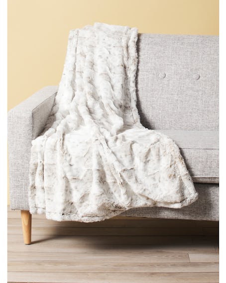This white throw blanket is what vanilla girl aesthetic is on TikTok. 