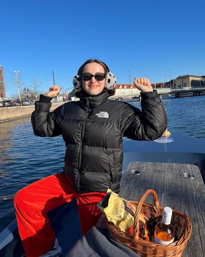 Maude Apatow wearing a black The North Face puffer jacket
