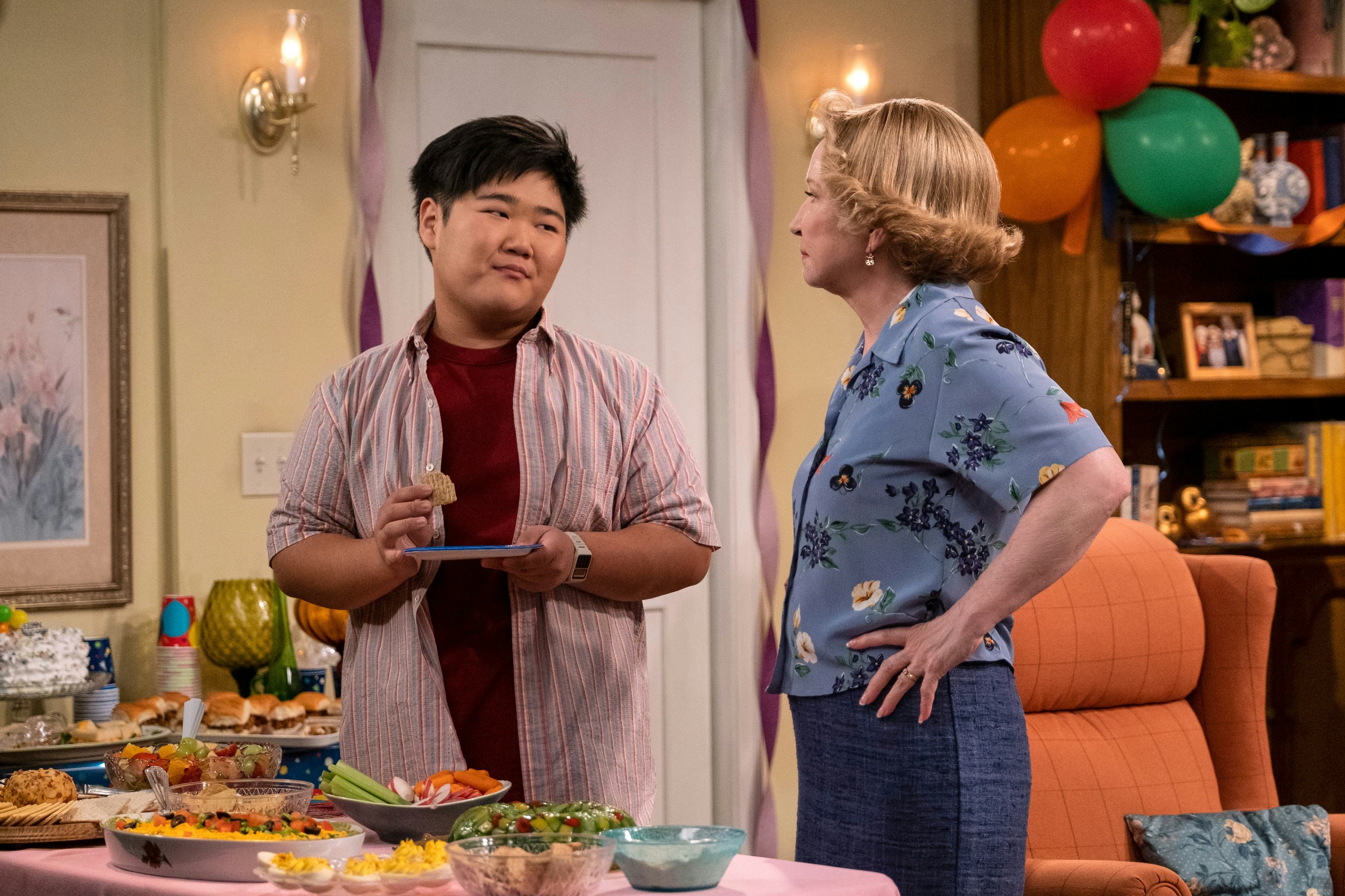 Reyn Doi as Ozzie, Debra Jo Rupp as Kitty Forman in episode 106 of &lsquo;That ‘90s Show&rsquo; via Netflix&rsquo;s pr&hellip;