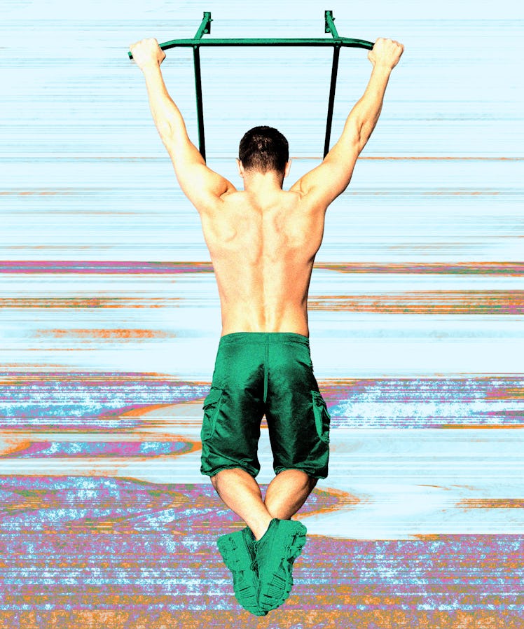 A man doing a dead hang.