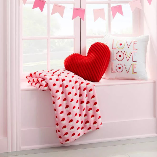 A heart throw blanket, pictured here with more Valentine's Day decor
