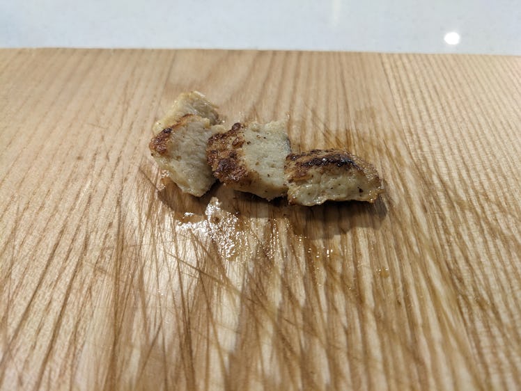 An image of the UPSIDE Foods cell-cultured chicken on a wood surface.
