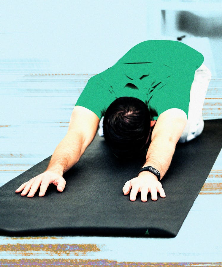 A man in child's pose yoga position to help him poop.
