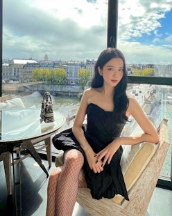 BLACKPINK's Jisoo Paris cafe with fishnets and dior purse