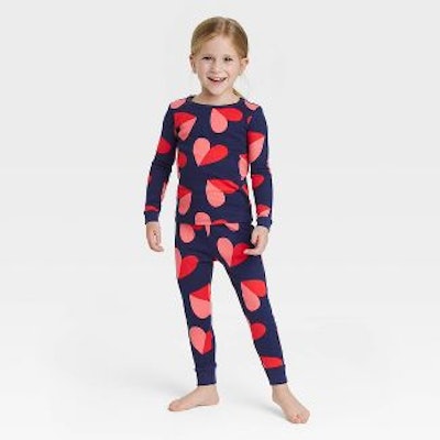 Toddler in heart pajamas for family pajama set 