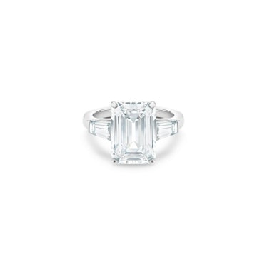 De Beers emerald-cut tapered diamond engagement ring