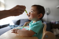FDA Announces Action To Reduce Lead Levels In Baby Food; baby being fed