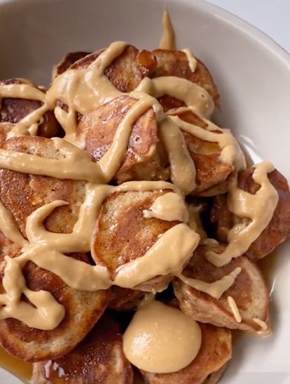 These pancake-covered bananas from TikTok are covered in syrup and peanut butter.