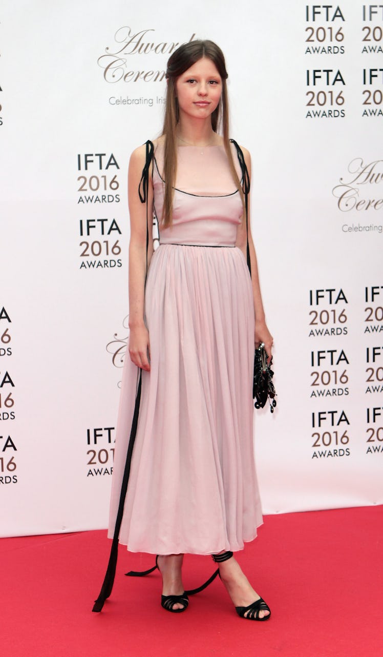 Mia Goth in pink dress. 