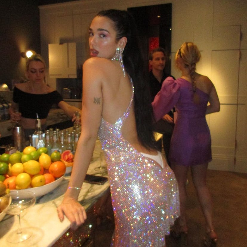 Dua Lipa wearing a dress with exposed thong detail