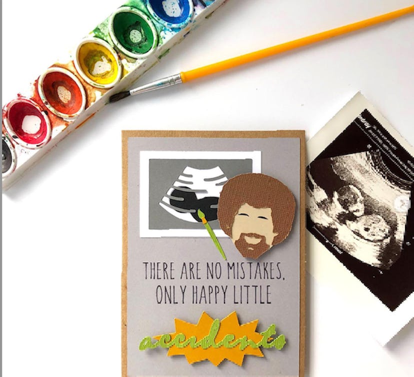 a card featuring Bob Ross, paintbrush, and ultrasound image as a funny pregnancy announcement