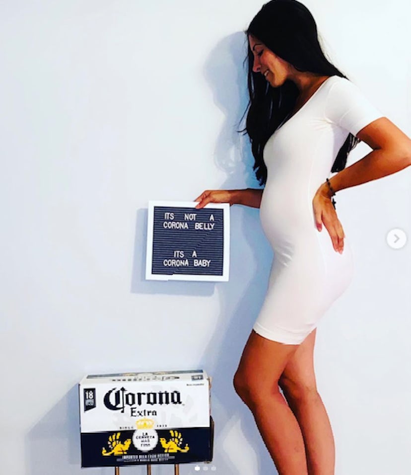 pregnant woman holding a letter board and a case of Corona beer for a funny pregnancy announcement