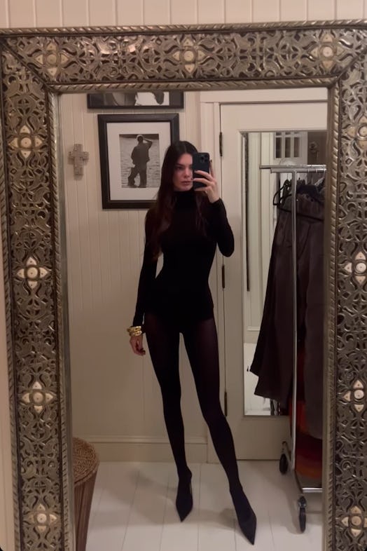 Kendall Jenner wearing a black bodysuit outfit for New Year's Eve 2022.