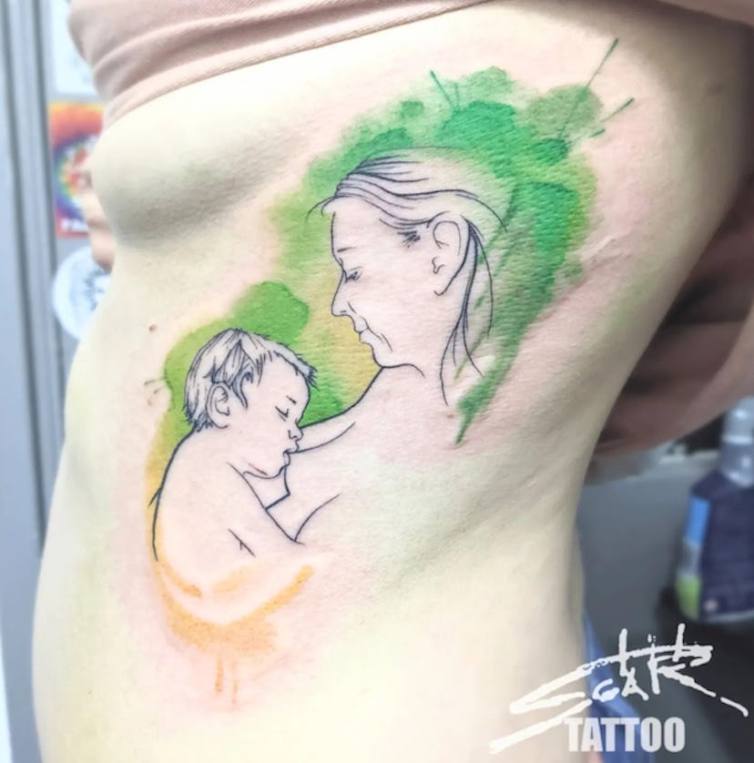 Placing your tattoo on your ribcage is one breastfeeding tattoo idea to consider.