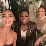 Oprah, jennifer lopez, and kim kardashian pose for a selfie