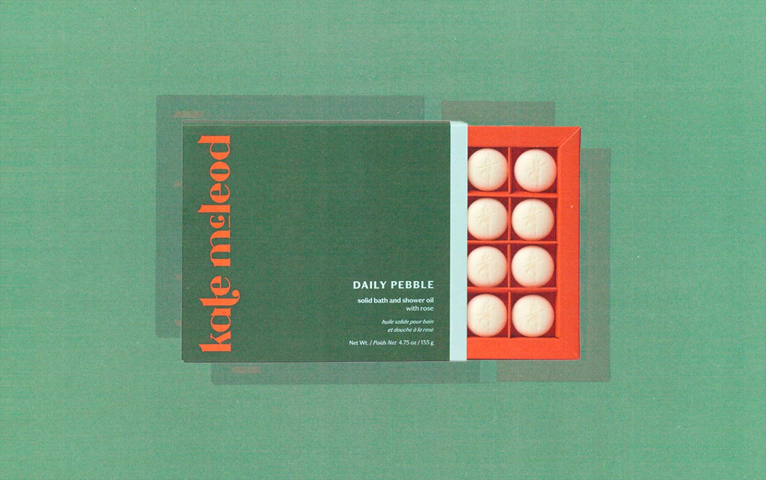 an image of a box of bath "pebbles" (small, round beads made with natural moisturizing oils)