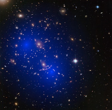 star cluster with a series of galaxies in the backgroun