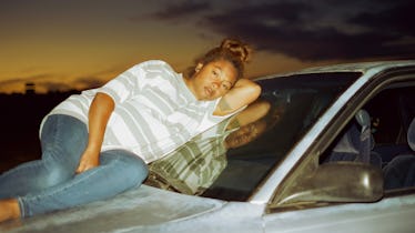 Savanah Leaf atop a car during sunset