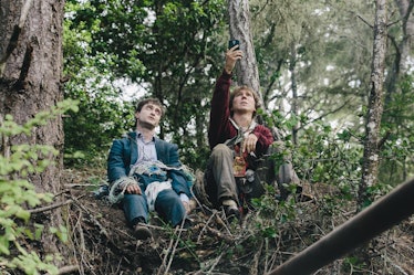 Hank (Paul Dano) and Manny (Daniel Radcliffe) sit on a hill together in 2016's Swiss Army Man