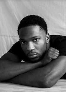 A black and white portrait of actor Tosin Cole