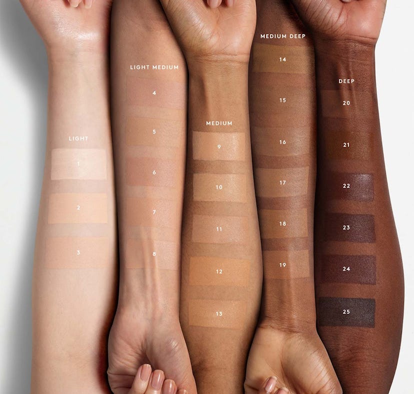 Models swatching Fenty Beauty's Eaze Drop Blurring Skin Tint