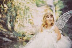 A toddler dressed up as a fairy in an article about beautiful fairy names