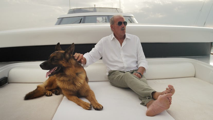 Maurizio Mian and his German shepherd dog in 'Gunther's Millions' via Netflix's press site