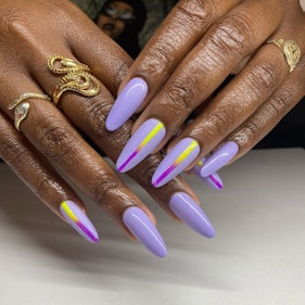 a lilac manicure with a multicolored stripe