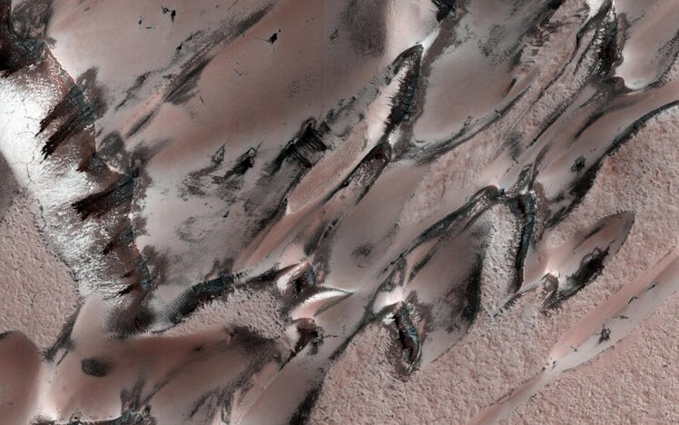 On Mars, Carbon dioxide frost and ice form over dunes during the winter. As this sublimates during s...